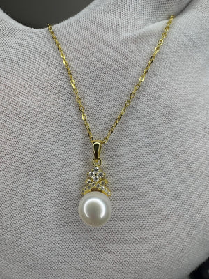18k Gold Plated Sterling Silver Necklace with Bread Shaped Round Natural Freshwater Pearl Pendant with Criss Cross Moissanite Stones 18k Gold Plated Sterling Silver Necklace with Bread Shaped Round Natural Freshwater Pearl Pendant with Criss Cross Moissanite Stones